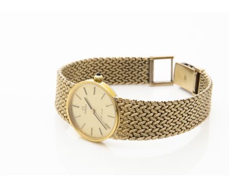 A c1980s Omega de Ville gold plated lady's wristwatch, 24mm case on integrated mesh strap, manual wind, appears to run 