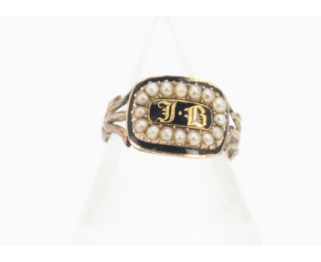 A 19th Century mourning ring, the enamel and seed pearl setting with gothic initials JB, on a trefoil shoulder and reeded sha