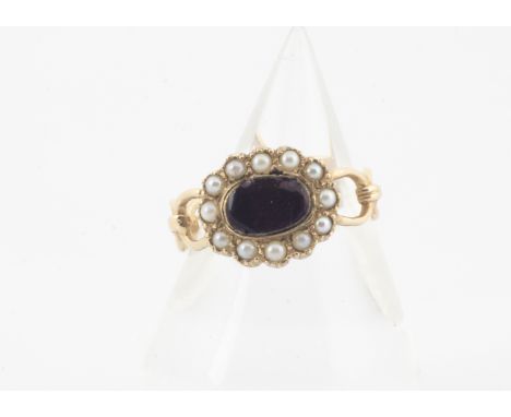 A 9ct gold enamel and seed pearl dress ring, in the style of an 18th Century mourning ring with oval setting and chain link s