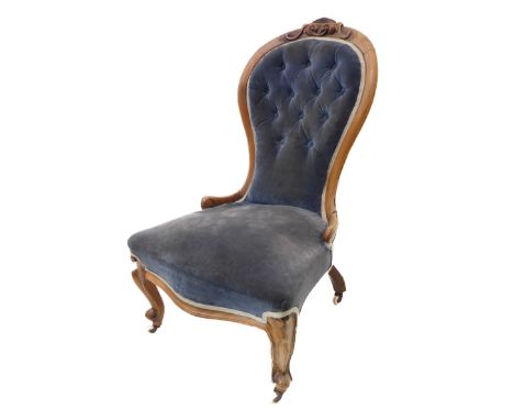 A 19th century spoon-back chair with blue button-back velour upholstery and moulded cabriole-style front legs