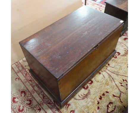 A mid-19th century red walnut chest: the underside of the lid with a pasted inventory of contents; two half-width hidden draw