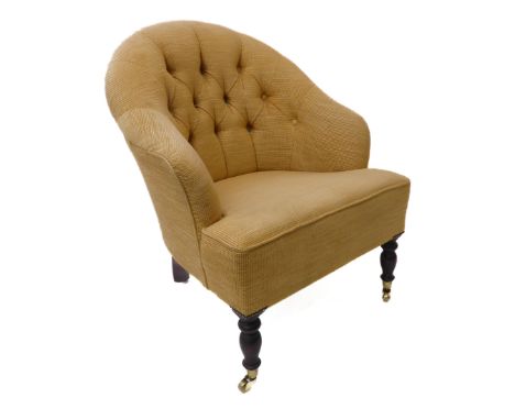 A modern (19th century style) button-back tub-style chair on turned legs with brass castors