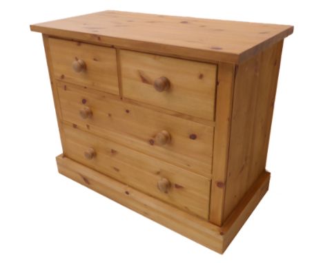 A modern pine chest: overhanging top above two half-width and two full-width drawers, raised on plinth base (92cm wide)