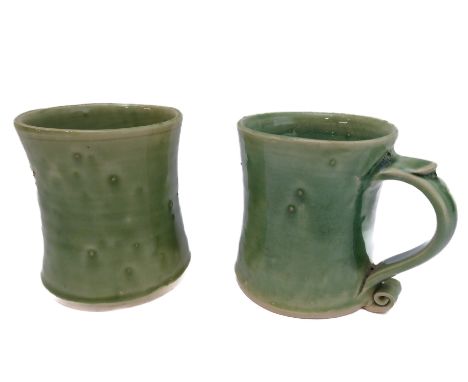 Jeremy Leach -&nbsp; a pair of celadon-type glazed pottery mugs of waisted form with ribbed scroll handles, impressed marks t