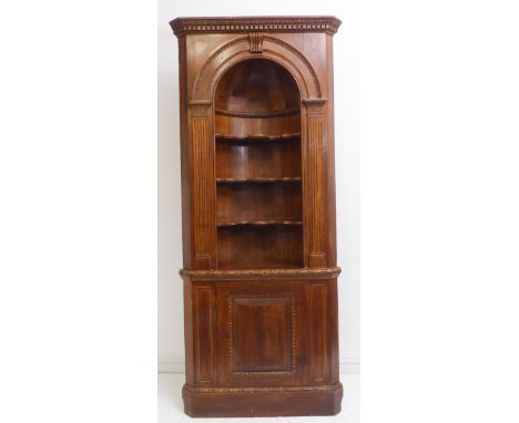 A good 18th-century-style stained-pine free-standing corner alcove-cupboard: dentil cornice above an arch with shaped shelves