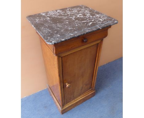 An early 20th century marble-topped French cherrywood bedside-style cabinet; the overhanging top above a single full-width dr