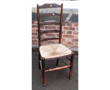 Rush seated ladder back chair. Condition report: see terms and conditions