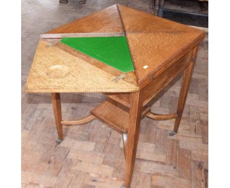 Edwardian light oak envelope table. Condition report: see terms and conditions