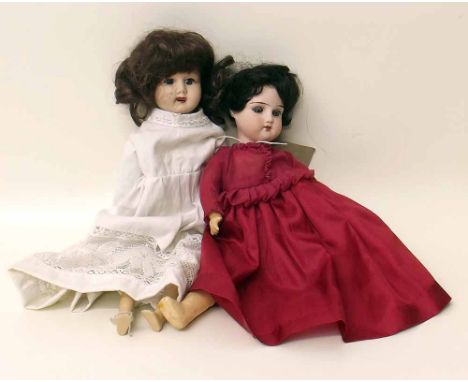 Two dolls one probably A&M marked 10/0 in red dress the other marked Melba. Condition report: see terms and conditions
