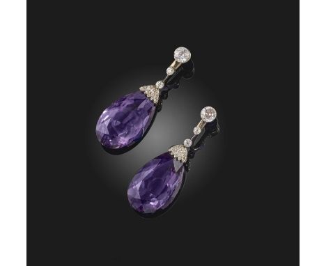 A pair of Edwardian amethyst and diamond drop earrings, the graduated diamonds set on knife-edge links suspending a pear-shap