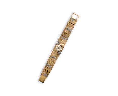 Longines, a lady's 18ct gold wristwatch, circa 1973, the silvered dial with baton indicators and gold hands, to a brick link 