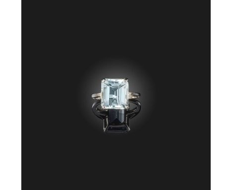 No reserve - an aquamarine solitaire ring, claw-set with a step-cut aquamarine weighing approximately 7.00 carats, mounted in