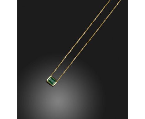 An emerald pendant, collet-set with a step-cut emerald weighing approximately 1.70 carats, to a fine chain, mounted in gold, 