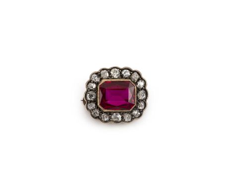 A synthetic ruby and diamond brooch, the step-cut synthetic ruby set within a border of old cushion-shaped diamonds in gold, 