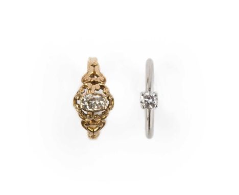 Two diamond rings, comprising: a late 19th/early 20th century ring set with an antique oval diamond, within a gold scroll mou