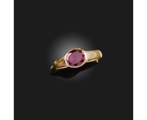 A garnet ring, circa 1695, centring on a shallow oval garnet in a foil-backed setting, to a plain band, inscribed 'H. Peach A