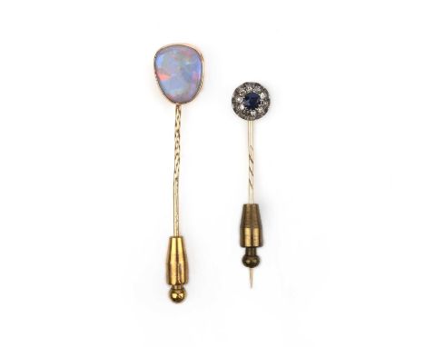 Two stick pins, late 19th/early 20th century, one set with a black opal measuring approximately 13 x 11mm, mounted in gold, t