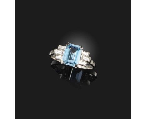 An aquamarine and diamond ring, designed as a step-cut aquamarine weighing 1.75 carats, between shoulders set with baguette d