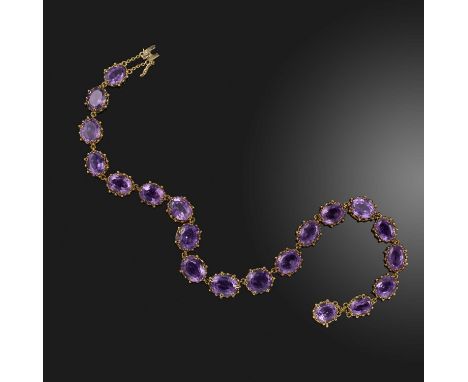 An amethyst rivière necklace, late 19th/early 20th century, designed as a series of graduated amethysts, mounted in gold, len