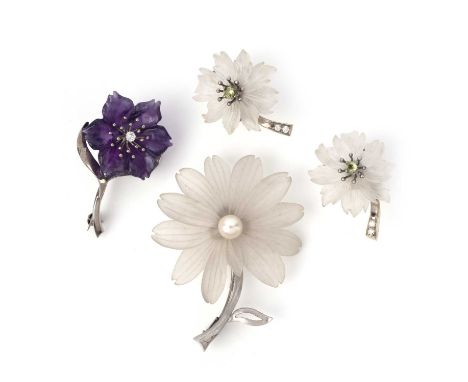 Two brooches and a pair of earrings, Austria, mid 20th century, comprising: two brooches, each designed as a flower in white 