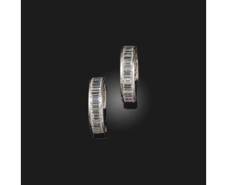 A pair of diamond earrings, designed as hoops, set with step-cut diamonds, length 2cm, post fittings