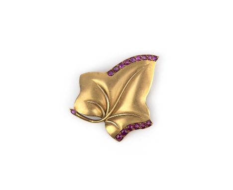 A Retro gold and ruby brooch, 1940s, modelled as an ivy leaf in gold, accented with circular-cut and oval rubies, length 4.6c