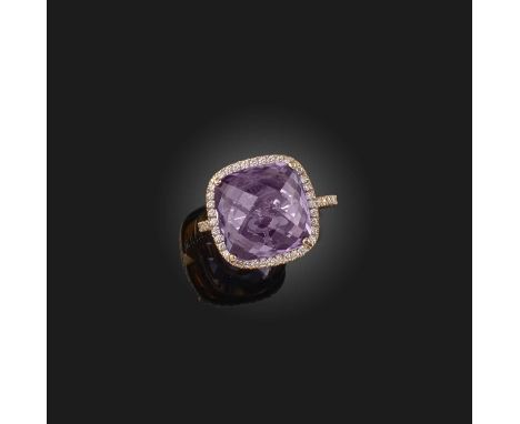 An amethyst and diamond ring, set with a chequerboard-cut amethyst, to a border and band set with brilliant-cut diamonds, mou