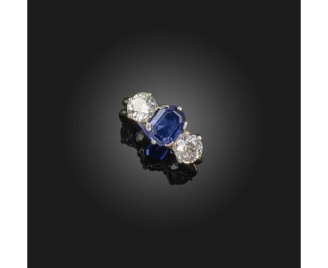 A sapphire and diamond ring, early 20th century, claw-set with an octagonal step-cut sapphire weighing approximately 1.50 car