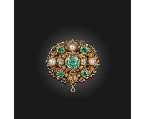 An emerald and pearl brooch, 1830s, of oval outline, set with foil-backed step-cut emeralds and pearls, in a gold cannetille 