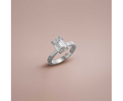 No reserve - A diamond solitaire ring, claw-set with a step-cut diamond weighing 5.52 carats, to a plain platinum shank, size