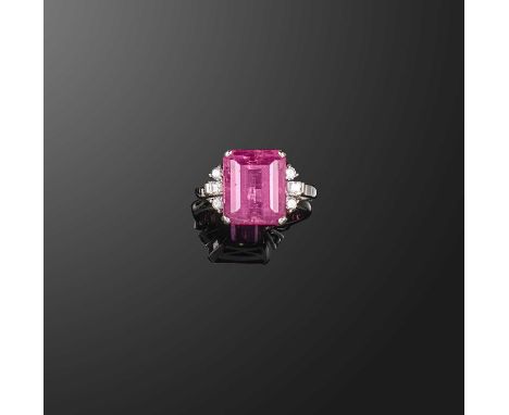 A tourmaline and diamond ring, set with a step-cut pink tourmaline weighing approximately 7.00 carats, to shoulders set with 