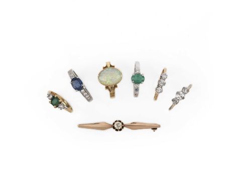 A group of jewels, comprising: a bar brooch, set with a cushion-shaped diamond, mounted in gold, length 4.7cm, case; two emer