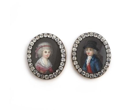 A pair of early 19th century miniature portrait brooches, depicting a lady and gentleman within paste borders and mounted in 