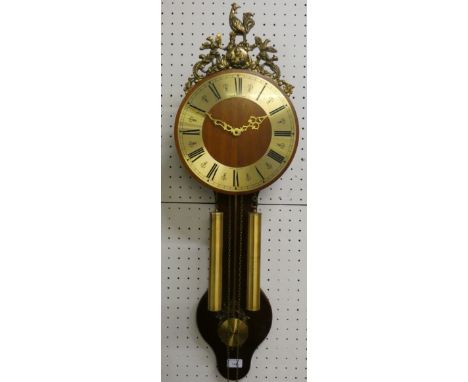 A Dutch style mechanical twin weighted mechanical wall clock