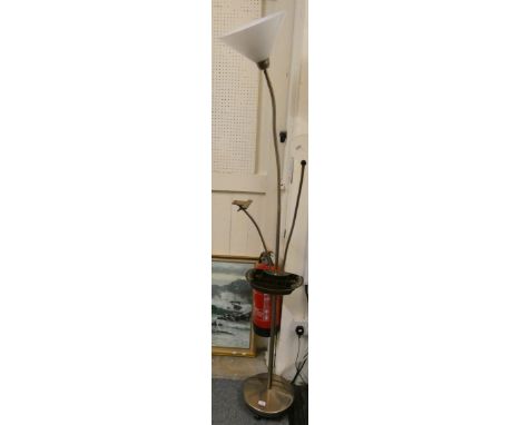 A multipurpose standard lamp with adjustable magnifying glass clip and light, made by Daylight