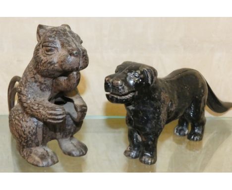 A cast metal novelty nutcracker in the form of a squirrel, together with a cast iron novelty nutcracker in the form of a St. 