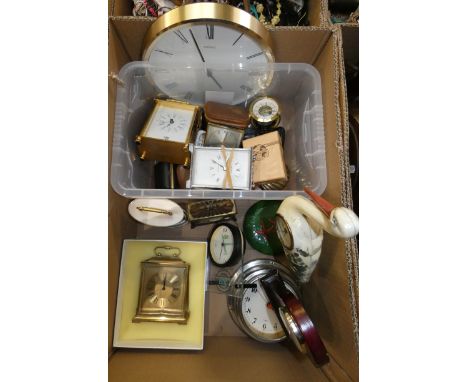 A variety of clocks, including an unusual stork clock, Starburst metame wall clock, a Swiza clock, travel clocks, wall clocks