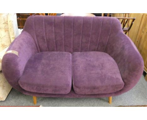 A modern two seater sofa in a lilac dralon fabric