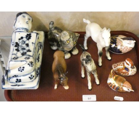 A Beswick grey shire foal and a larger white example, three Royal Crown Derby figures (one lacking stopper), an indistinctly 