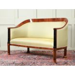 A WALNUT AND EBONISED SOFA IN BIEDERMEIER STYLE