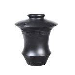 A BLACK PAINTED MODEL OF AN URN