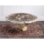A PART POLISHED PETRIFIED WOOD CENTRE TABLE