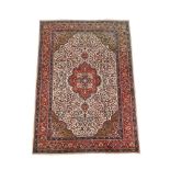A PERSIAN TABRIZ CARPET
