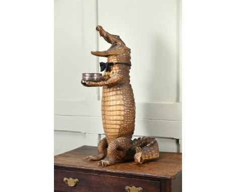Y&nbspA PRESERVED CROCODILE 'DUMB WAITER'  INCORPORATING LATE 19TH CENTURY TAXIDERMY ELEMENT  The animal modelled on its haun
