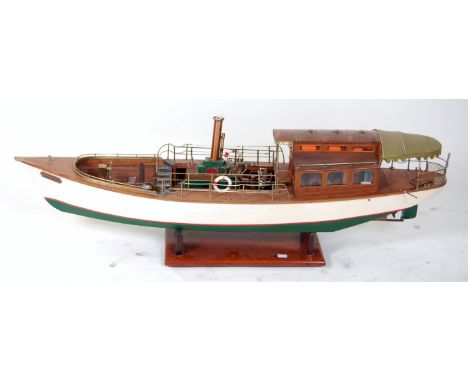 A Windermere style steam launch 'Rose', clinker built hull of wood with varnished planked deck, wood cabin with rear fabric a