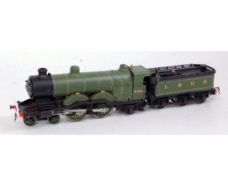 A white metal kit built model of a GNR Atlantic engine and tender finished LNER green as No 3286, wheels would benefit from c