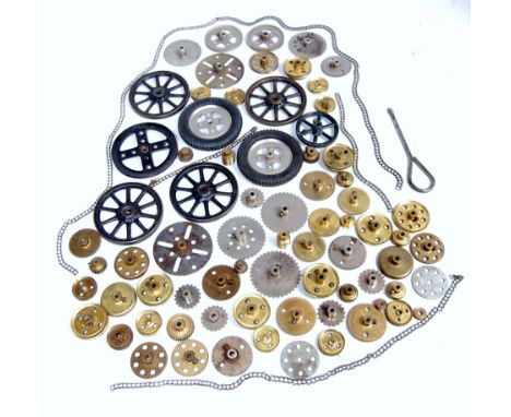 Selection of early meccano wheels and gear, one each of first patterns 2" and 3" pulleys