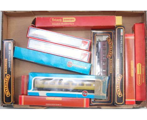 12 mixed manufactured 00 scale coaches and rolling stock to include Hornby Mainline Airfix and Lima, examples to include Horn