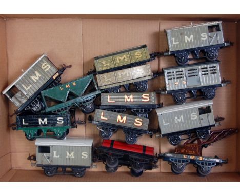 A large box of 13 prewar Hornby LMS wagons including hopper, gas cylinder, crane truck, No. 1 cattle, open 'B', 3x No. 1 open