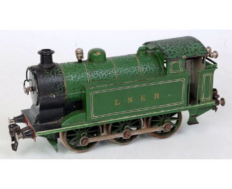 A Marklin green clockwork LNER 0-6-0 tank locomotive, with TM1020 to rear of bunker, fitted with speed control (crazing to va
